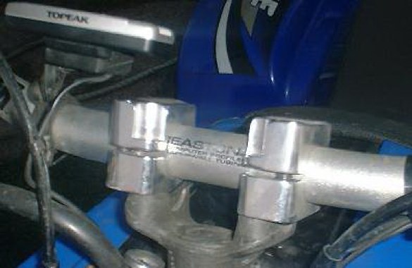 CLOSEUP OF THE HANDLE BAR CLAMPS