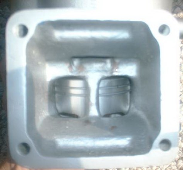 PISTON PEEKING THROUGH THE INTAKE PORTS